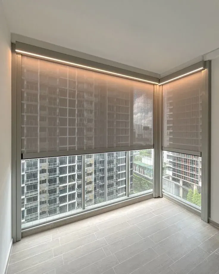 Motorized roller shades on tall Sheridan windows